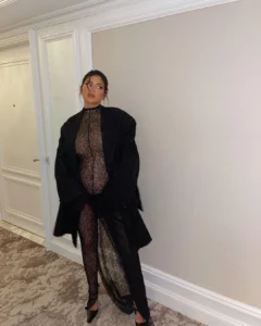 Pregnant Kylie Jenner showcases her baby bump in see-through lace jumpsuit (Photos)