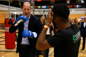 Prince William looks spiffy in suit while throwing punches for charity